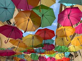 Colorful umbrellas hanging over a European street