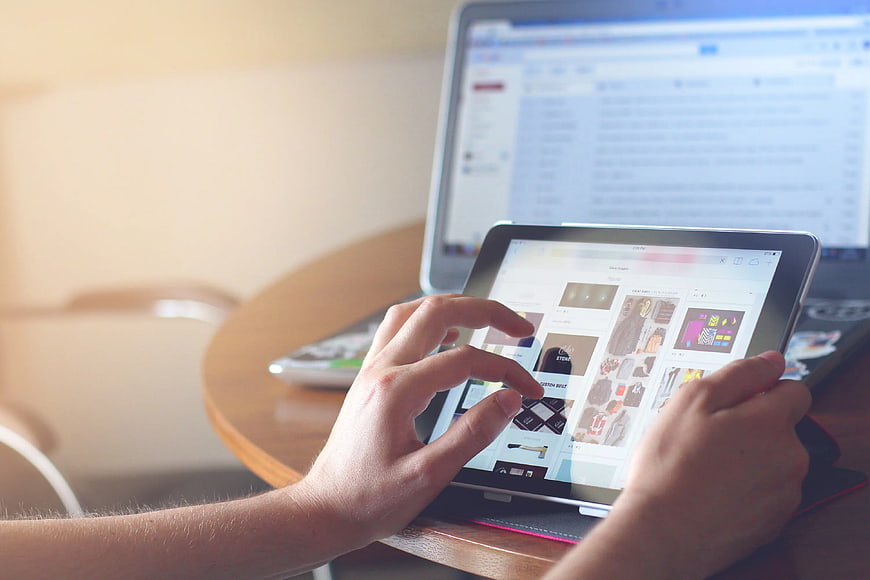 Hands Using Tablet and Laptop for Online Shopping