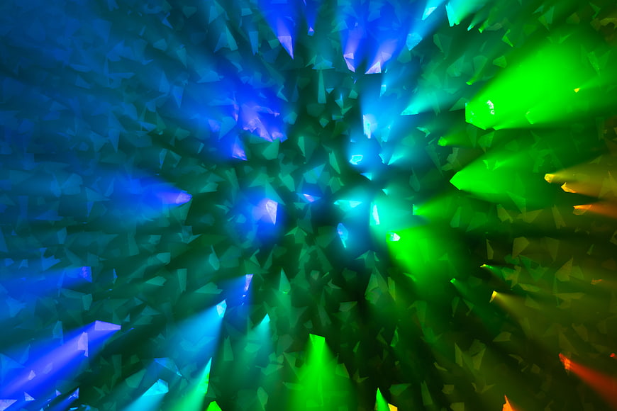 Abstract Blue and Green Geometric Light Burst Background