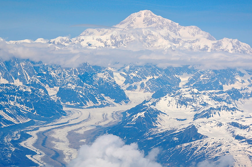 Aerial View of Snow-Capped Mountain Peak and Glacier Valley