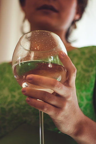 Woman Holding Glass of White Wine Close Up
