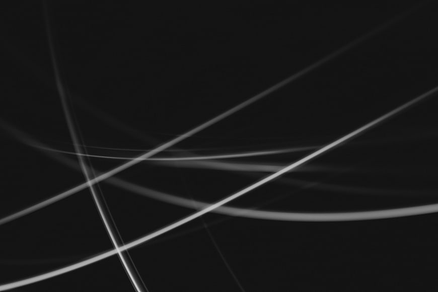 Abstract Black and White Light Streaks on Dark Background