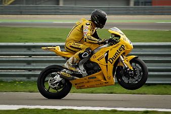 Yellow Racing Motorcycle Wheelie on Track