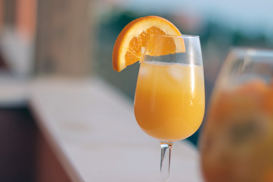 Refreshing Mimosa Cocktail with Orange Slice Garnish