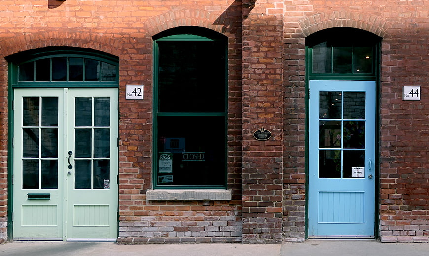 Colorful Doors on Old Brick Building Facade