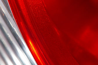 Abstract Close-Up of Red Textured Surface with Chrome Reflection
