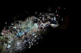 Abstract Soap Bubbles with Iridescent Colors on Black Background