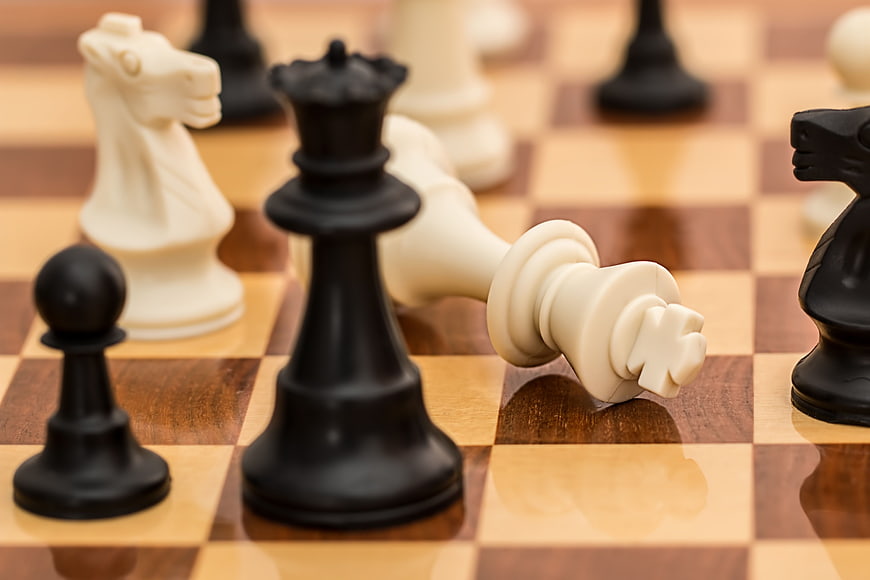 Close-up of Chess Checkmate with Fallen White King