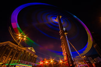 Long Exposure of Spinning Amusement Park Ride at Night