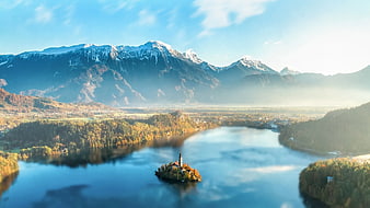 Aerial View of Lake Bled Island and Snowy Mountains