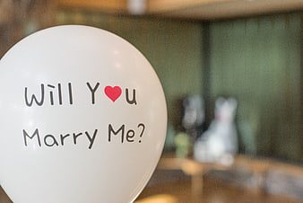 White balloon with will you marry me text and red heart