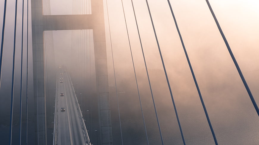 Aerial View of Cable-Stayed Bridge in Foggy Morning Light