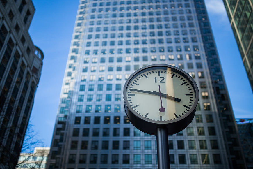 Street Clock in Front of Modern Skyscraper