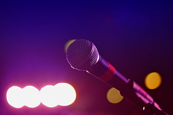 Microphone on Stage with Purple and Pink Bokeh Lights