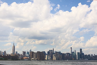 New York City Skyline View Across the Water with Clouds
