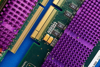 Close-up of purple computer heat sinks and circuit board