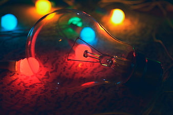 Vintage Light Bulb with Colorful Bokeh Background