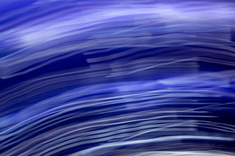 Abstract Blue Motion Blur Background with Flowing Light Streaks