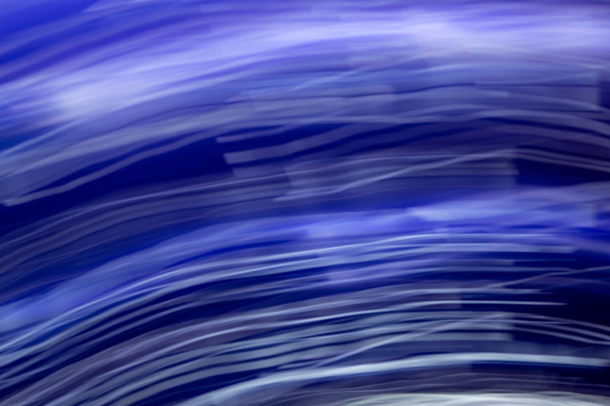Abstract Blue Motion Blur Background with Flowing Light Streaks