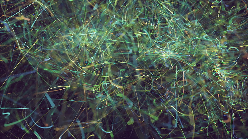 Abstract green and blue light trails on dark background