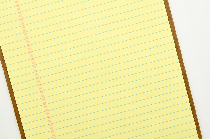 Blank Yellow Lined Paper on Clipboard Background