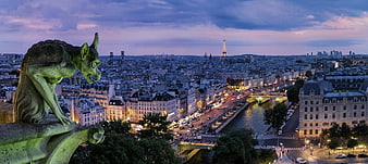 Gargoyle Statue Overlooking Paris Cityscape at Dusk