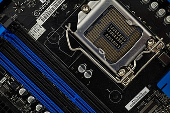Close-up of computer motherboard CPU socket and RAM slots