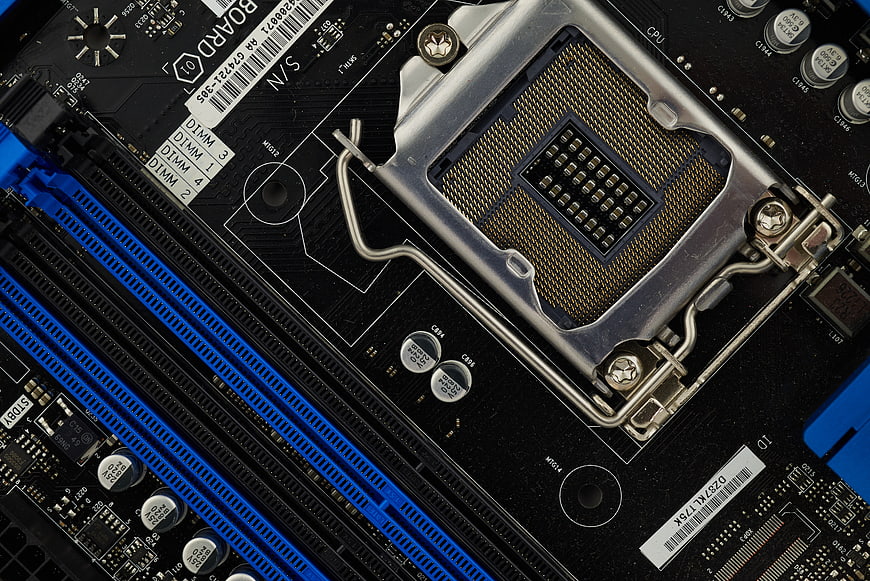 Close-up of computer motherboard CPU socket and RAM slots