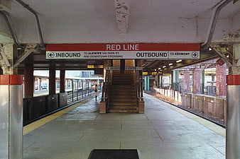 Red Line subway station platform with directional signage