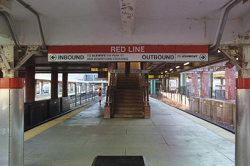Red Line subway station platform with directional signage