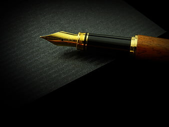 Luxury fountain pen nib on dark textured background
