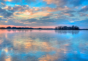 Frozen Lake Sunset with Blue and Orange Sky Reflections