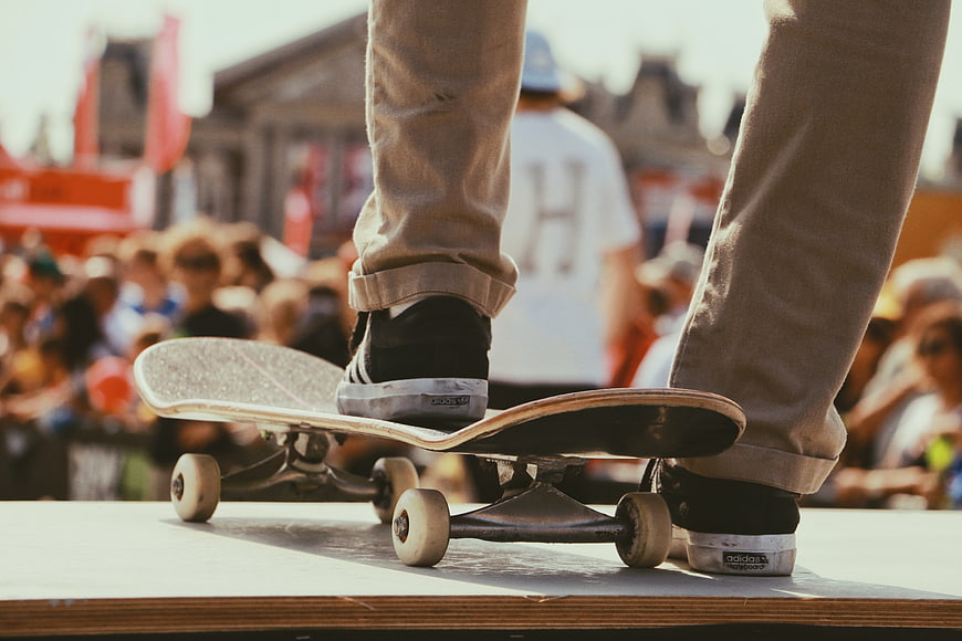 Skateboarder Feet on Board at Outdoor Event