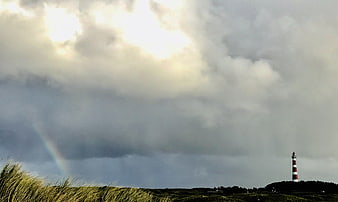 Lighthouse on Ameland with Rainbow and Stormy Sky