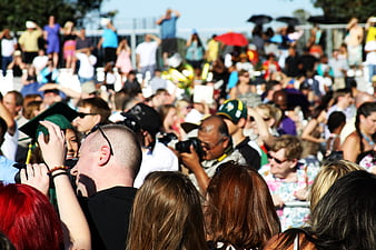 Crowd of spectators at outdoor graduation event