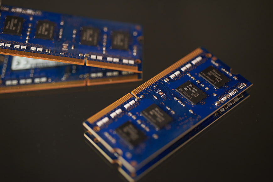 Blue DDR3 RAM Sticks on Black Surface