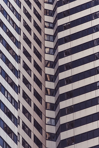 Abstract modern office building facade with repeating window patterns