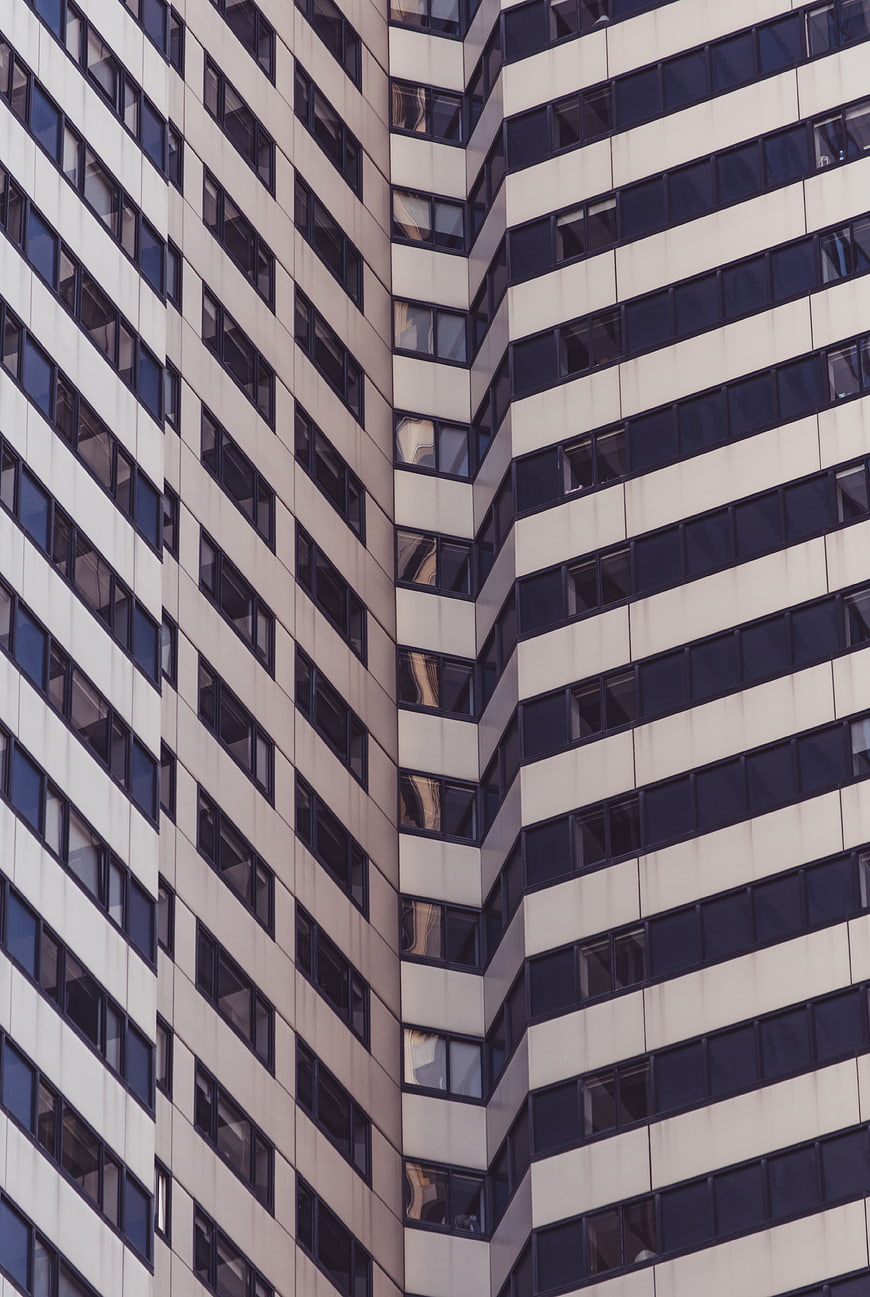 Abstract modern office building facade with repeating window patterns