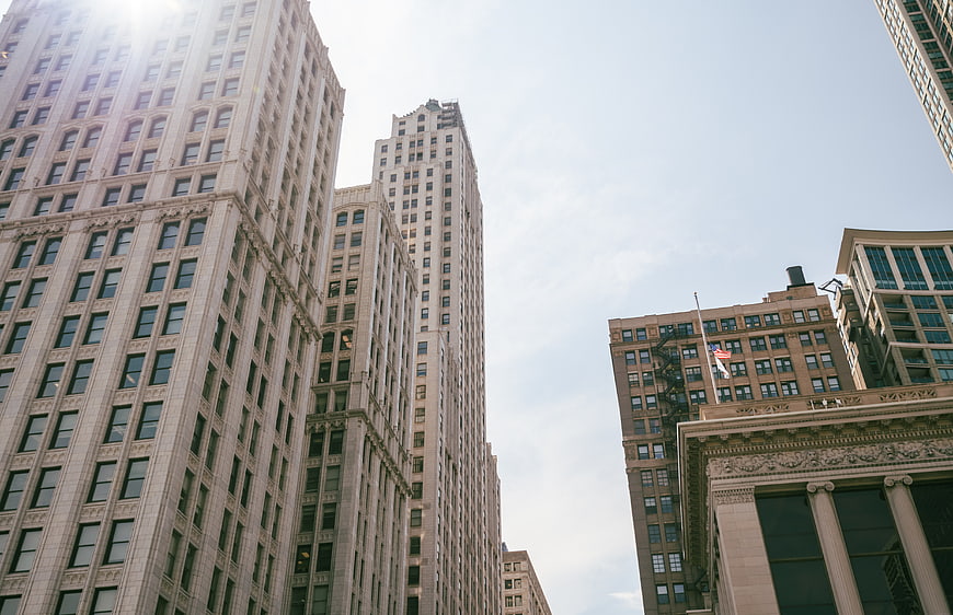 Low angle view of tall city skyscrapers and architecture