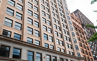 Low angle view of historic brick apartment building facade