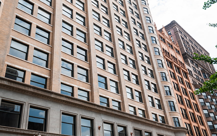 Low angle view of historic brick apartment building facade