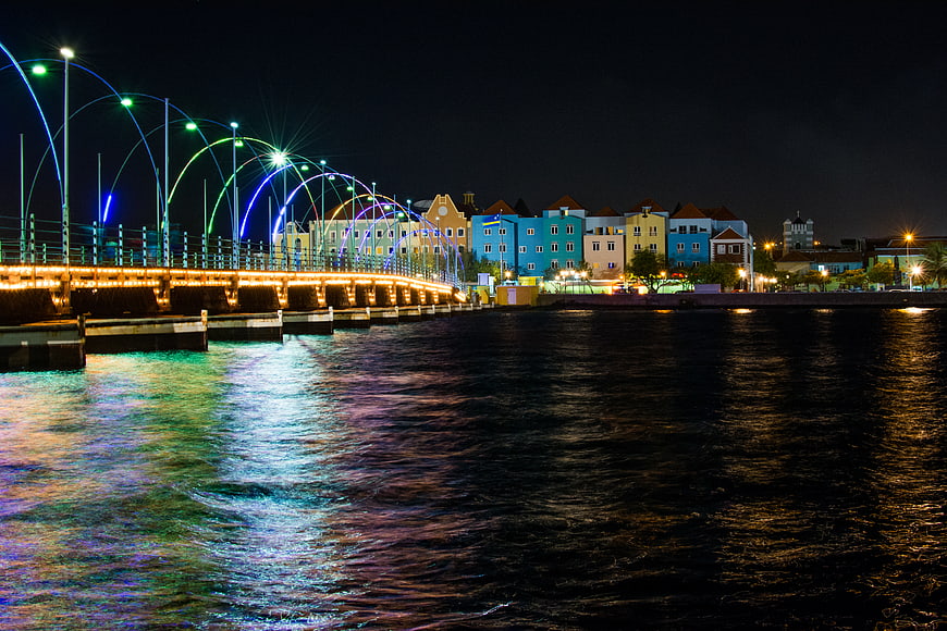 Colorful Pontjesbrug Bridge at Night with Water Reflections