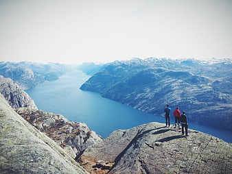 Hikers on Preikestolen overlooking Lysefjord in Norway