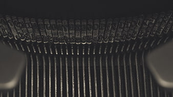 Close-up of vintage typewriter keys and metal typebars