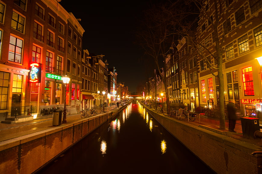 Amsterdam Canal Night View with Neon Lights and Reflections