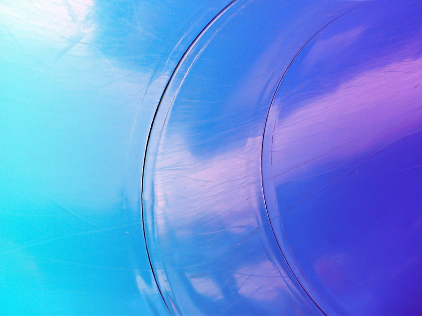 Abstract Blue and Purple Glossy Surface with Reflections