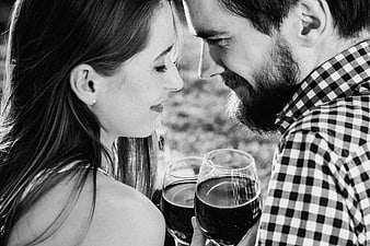 Intimate Black and White Portrait of Couple Sharing Wine